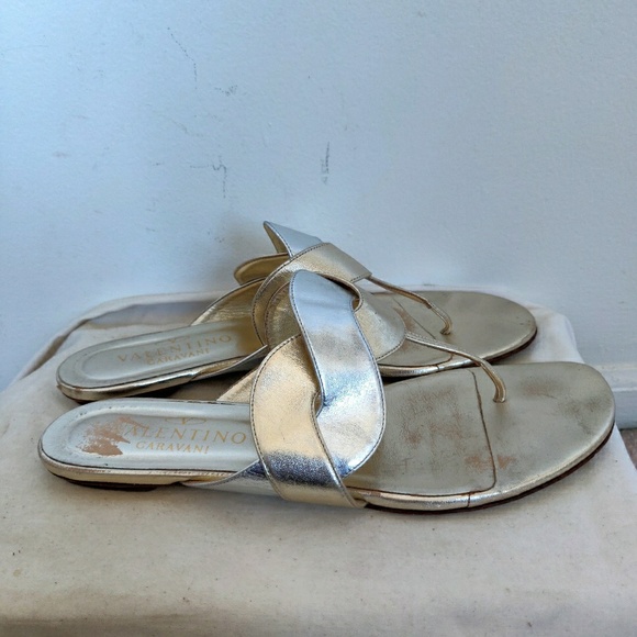 gold and silver flip flops